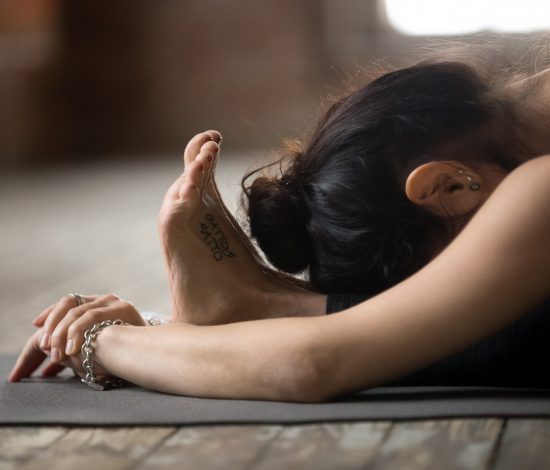 young-woman-doing-paschimottanasana-exercise